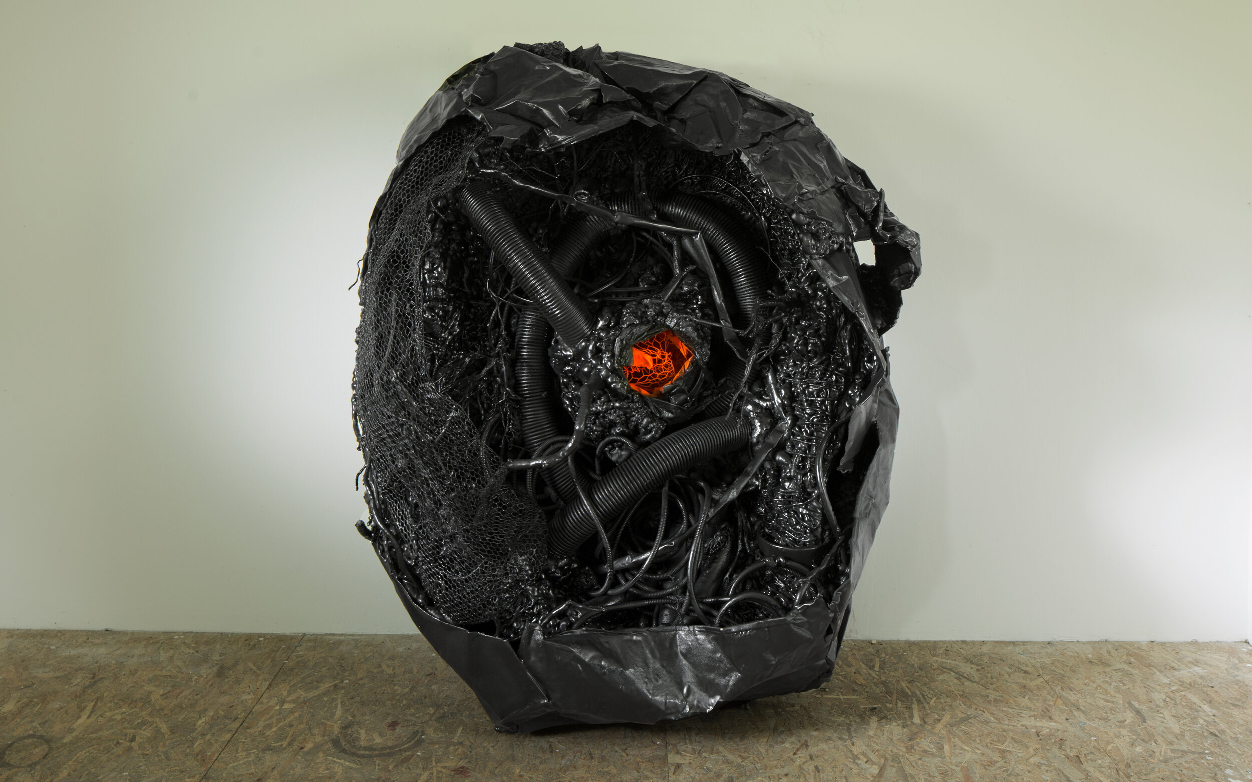  VULCAN, 215 x 175 x 100 cm, 2020, Polyurethane foam, plastic tubes, tree branches, electric cables, recycled plastics, plastic bucket, metal and plastic net, roots, earth, Nokia phone, steel wastes, plastic skeleton, polyurethane cans, polystyrene s